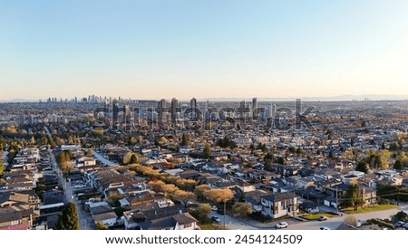 Beautiful sunset over the skyline of Burnaby in the Lower Mainland during a spring season in British Columbia, Canada Royalty-Free Stock Photo #2454124509