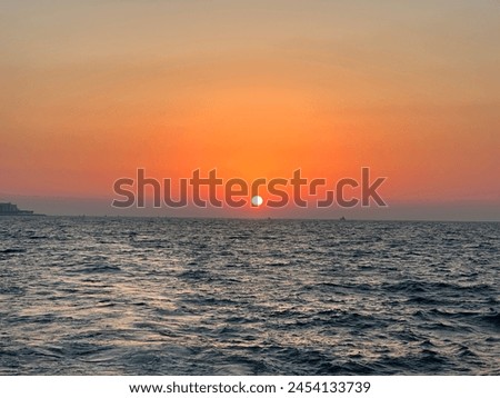 Sunset is the disappearance of the Sun below the horizon of the Earth (or any other astronomical object in the Solar System) due to its rotation. Royalty-Free Stock Photo #2454133739
