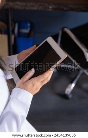 Woman typing and working on smart phone