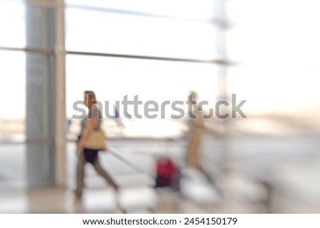 Motion blur, busy and people in airport for travel, check in or departure to Australia. Walking, movement and mature person with suitcase for holiday, business trip or morning flight on terminal