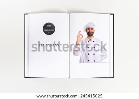Chef making Ok sign printed on book