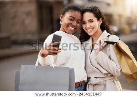 Selfie, people and paper bag for photography for memory by mall, sale or retail together outdoor by store. Happy women, smile and friends with city for online shopping, discount and fashion.