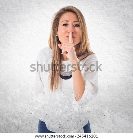 Woman making silence gesture