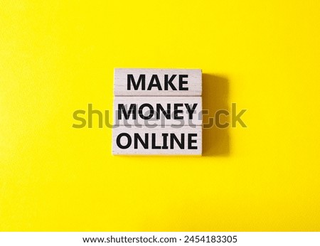 Make Money Online symbol. Concept words Make Money Online on wooden blocks. Beautiful yellow background. Business and Make Money Online concept. Copy space.