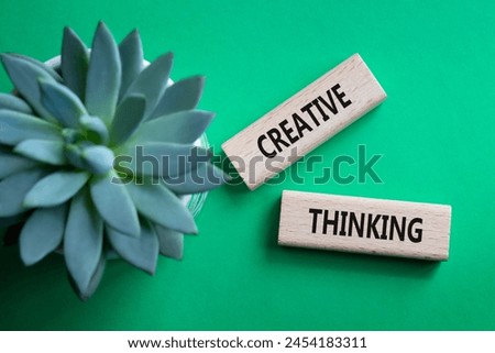 Creative thinking symbol. Wooden blocks with words Creative thinking. Beautiful green background with succulent plant. Business and Creative thinking concept. Copy space.
