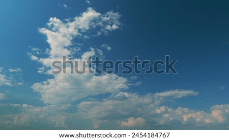 Purple Afternoon Sky And Clouds. Background Of Blue Sky With Pale Pink Clouds At Day. Royalty-Free Stock Photo #2454184767