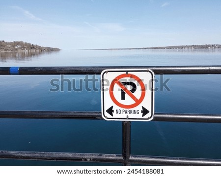 No parking signs on a waterfront.