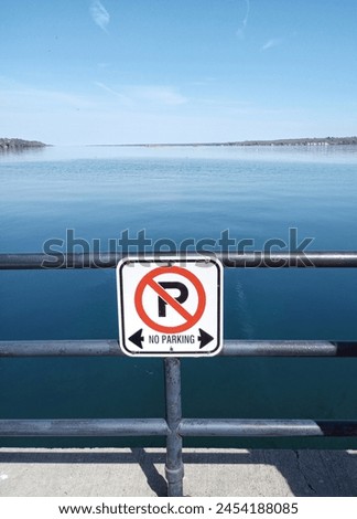 No parking signs on a waterfront.