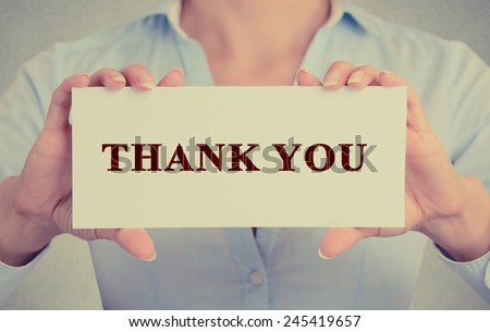 Closeup retro vintage style image business woman, female, girl, person hands holding white rectangle sign or card with message thank you isolated on gray office wall background. Royalty-Free Stock Photo #245419657