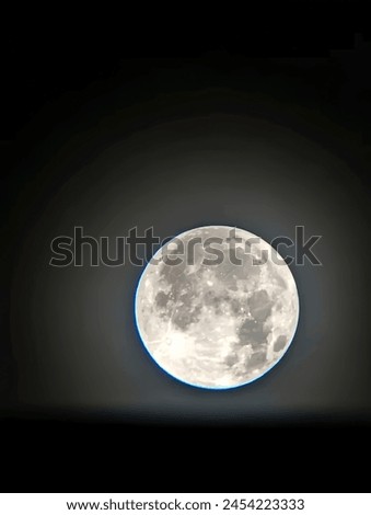 The image is of a planet in space, with moonlight shining on it. It captures a celestial event with the planet resembling a sphere under the light of a full moon. The photo depicts a scene from outer 