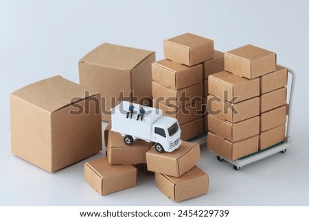 packed cardboard boxes and truck