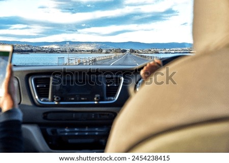 Driving touring with safety, use the navigator to guide you, don't waste time and don't get lost. Royalty-Free Stock Photo #2454238415