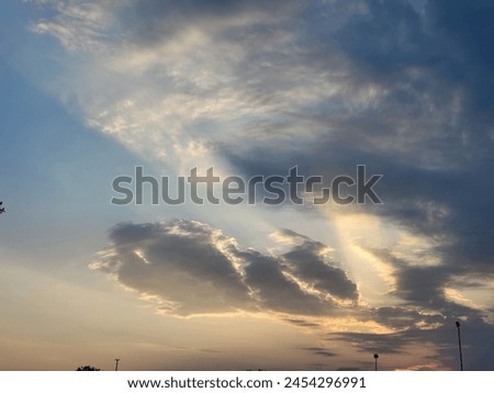 A cloudy sky can be a mesmerizing sight, casting a veil of mystery and drama over the landscape. Picture a vast expanse of atmosphere, where billowing clouds drift lazily or race across the heavens