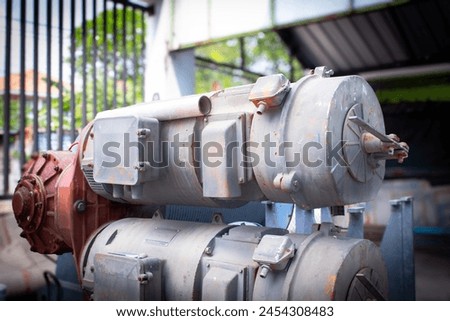 about testing gear motors of the tower crane hoist at a workshop Royalty-Free Stock Photo #2454308483