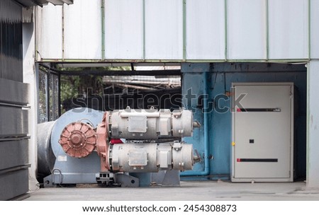 about testing gear motors of the tower crane hoist at a workshop Royalty-Free Stock Photo #2454308873