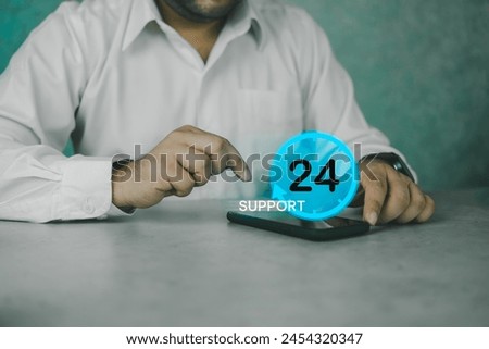 Nonstop service concept. Nonstop business internet technical support work. Man use smart phone with virtual 24-7 clock, worldwide web full-time available contact of service. Always customer service Royalty-Free Stock Photo #2454320347