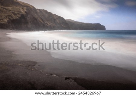 Long exposure picture of the beach in Azores in cloudy and rainy day
