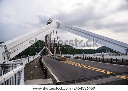The Nanfang'ao Bridge is a cross-port bridge spanning the Nanfang'ao Fishing Port in Su'ao Town, Yilan County, Taiwan. It is a local landmark. The picture shows the old bridge before reconstruction.
