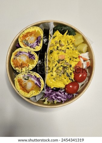 Kito kimbap with eggs and vegetable salad with sweet pumpkin. Diet food. A picture taken on pretty plating