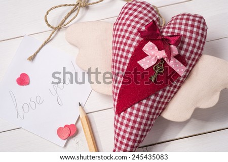 Declaration of love on Valentine's Day. Textile toy made by hand in the form of heart
