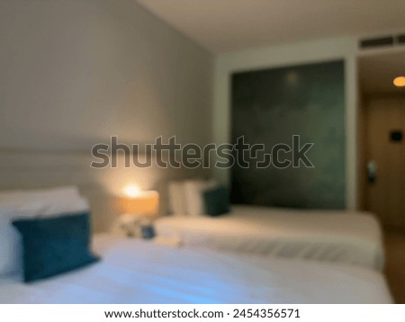 Blur focus of Stylish bedroom in white and green color. Scandinavian interior design.