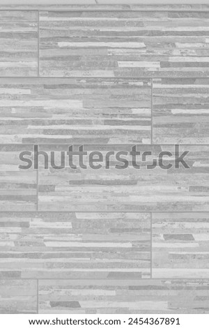 Stone brick light grey blocks with abstract pattern wall facade texture background.