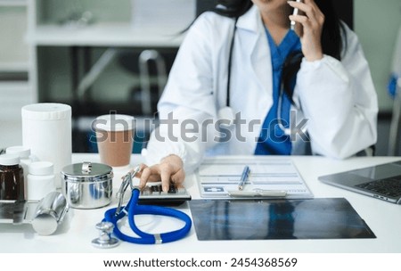 Doctor used a calculator, conduct financial transactions via tablets and data documents, put on the desk in the morning.