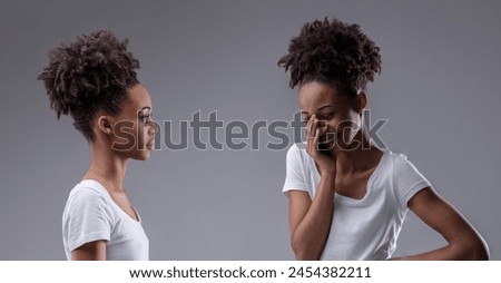 Laughter meets disapproval in a black woman's internal conversation, a self-mockery of her naivety Royalty-Free Stock Photo #2454382211
