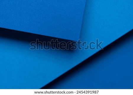 Overlapping blue construction paper background