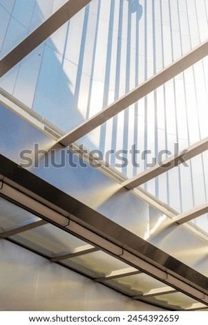 Modern architecture details background with metal and glass. Shopping mall, office building or greenhouse