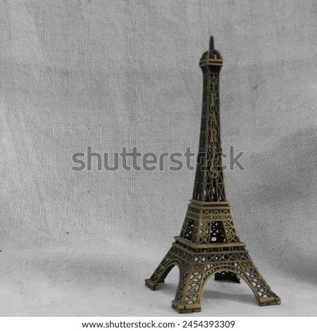Miniature Eiffel Tower Statue on White Background
A close-up photo of a vintage miniature Eiffel Tower statue. Perfect for home decor, a gift, or a souvenir.