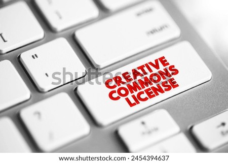 Creative Commons license - one of several public copyright licenses that enable the free distribution of an otherwise copyrighted work, text concept button on keyboard Royalty-Free Stock Photo #2454394637