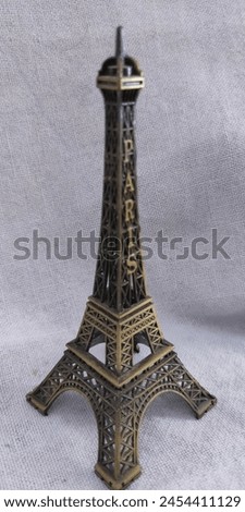 Close-Up Photo of Vintage Miniature Eiffel Tower
A close-up photo of a vintage miniature Eiffel Tower statue made of metal. Perfect for home decor, a gift, or a souvenir.