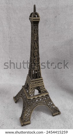 Close-Up Photo of Vintage Miniature Eiffel Tower
A close-up photo of a vintage miniature Eiffel Tower statue made of metal. Perfect for home decor, a gift, or a souvenir.