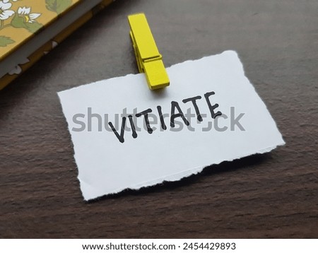 Vitiate writting on table background. Royalty-Free Stock Photo #2454429893