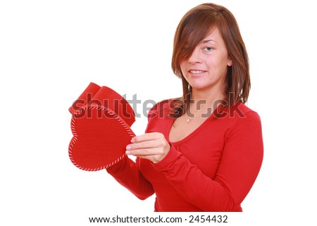 beautiful young girl with red heart isolated on white