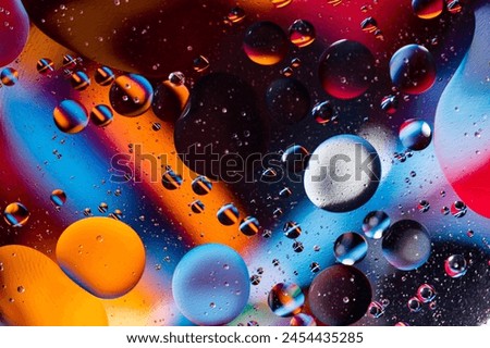 movement of oil bubbles. Fantastic structure of colorful bubbles. Abstract colorful background. Closeup bubbles in water.