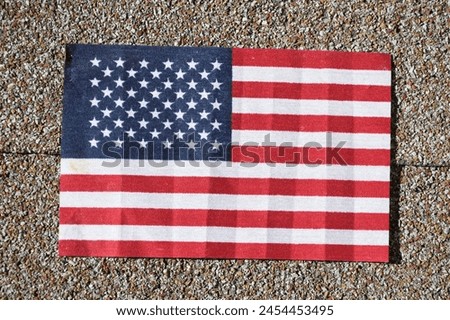American flag with gray cement background