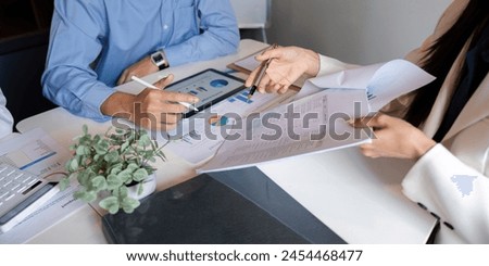 Business team talking planning analyze investment and marketing on tablet, collaboration discussing working analyzing with financial data and marketing business strategy project in office