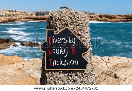 DEI diversity equity and inclusion symbol. Concept words DEI diversity equity and inclusion on blackboard. Beautiful stone background. Business DEI diversity equity and inclusion concept. Copy space.