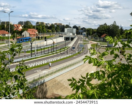 New city highway in Krakow, Poland, called Trasa Lagiewnicka with tunnels, tramway and multilevel crossroads. Slip ways and special pavements for bicycles and pedestrians 