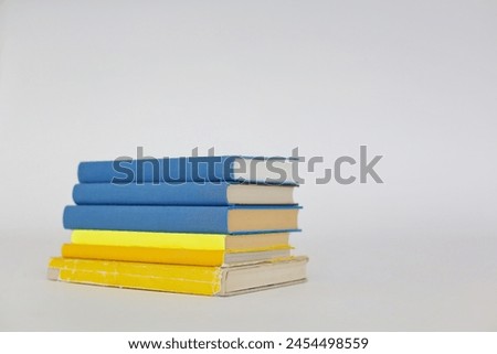 Stack of books on white background, Ukrainian colors, Ukrainian flag, Liberation war, Independence, Defensive war,