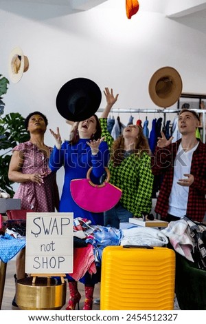 Swap party, garage sale - clothing exchange between college friends. Hats, bags, dress, jeans, jacket. Vintage finds, bargain hunting. Sustainable living, conscious consumption, textile pollution