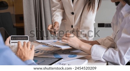 Business team meeting where the team leader is presenting a work plan graph. Discuss and summarize work results in the conference room.