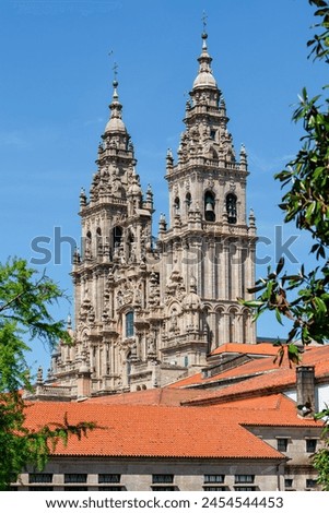  Ornate Baroque towers soar into the blue sky, showcasing the grandeur of historical religious architecture.