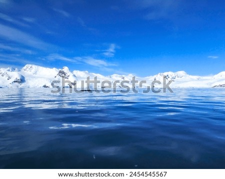 Antarctica Penguins Ice Fjords Snowcapped Mountains Royalty-Free Stock Photo #2454545567