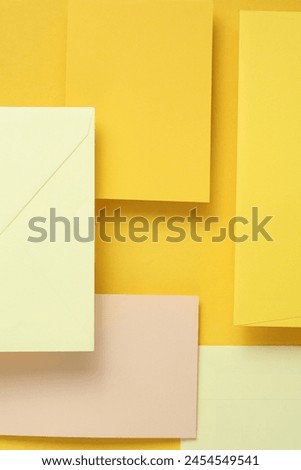 Set of floating envelopes and cards on a yellow background. Invitations, corporate identification