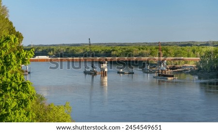 new bridge still under construction over the Missouri River near Rocheport in Missouri as seen from Katy Trail Royalty-Free Stock Photo #2454549651