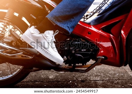 kick starter to start the motorbike, motorcycle broken down The engine won't start. The engine has a problem Royalty-Free Stock Photo #2454549917