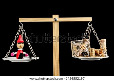 A wooden scale with a man on one side and money on the other. The man is a character from a fairy tale, and the money is a symbol of wealth. Concept of the difference between wealth